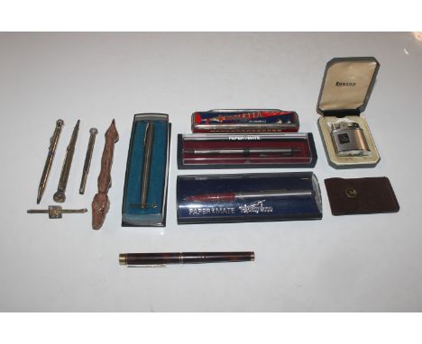 A box containing a Harmonica, cigarette lighter, novelty pen in the form of a dog, Shaffer fountain pen with 14ct gold nib, v