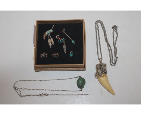 A large Sterling silver polished horn North American Indian pendant and chain; other Indian silver, turquoise pendants etc. 