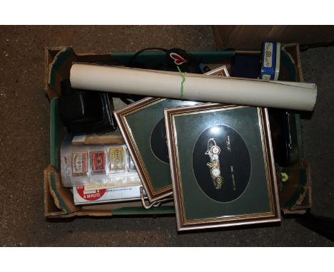 A box containing matchbox covers, cameras, prints etc.
