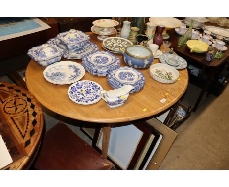 An blond Ercol drop leaf dining table