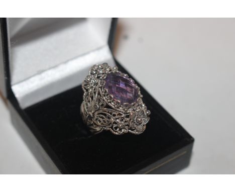 A silver and amethyst set ring 