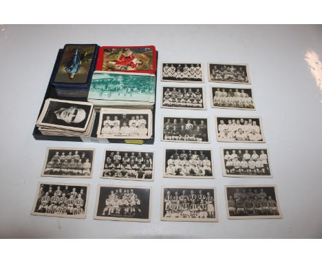 A collection of playing cards and trade cards depicting sportsmen