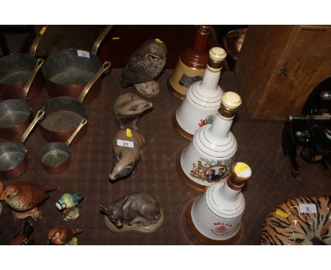 A Poole pottery model owl, by B. Lindy Adams; a Poole Pottery model of a deer and two Poole Pottery models of badgers 