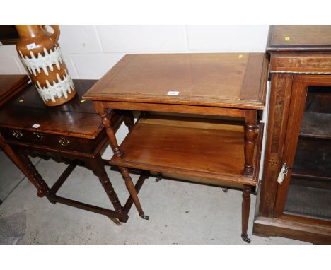 A Victorian oak two tier buffet raised on ring turned supports