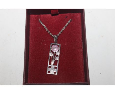 A silver and enamel pendant on silver chain 