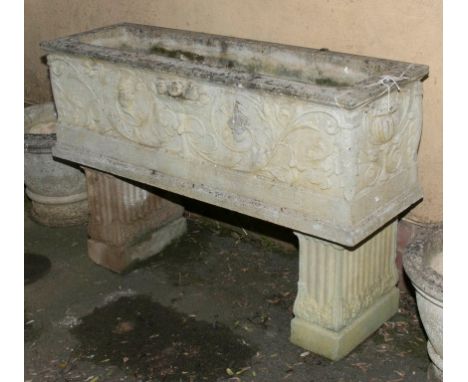 A Haddonstone Venetian trough, model A650, on a pair of fluted supports, model A670