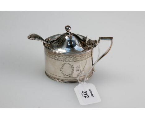 John Emes, a silver lidded mustard, with knop finial and angular handle, the body decorated with chased bands, London 1800, t