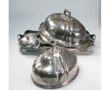 A large Sheffield plated domed oval meat cover, of segmented form, with cast handle, 46cm long, together with one similar sma