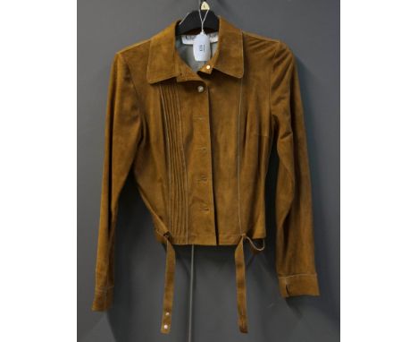 Christian Dior, a lady's short waited tan suede jacket, with pin tuck detail to one side, wide collar and belted to hem