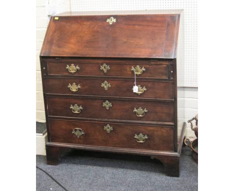 A George III mahogany fall front writing bureau, with simple fitted interior, over four long drawers, raised on shaped bracke