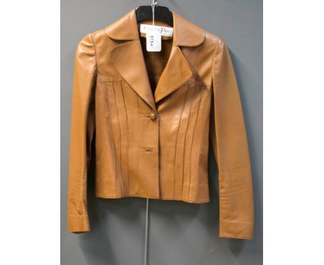 Christian Dior, a lady's lamb skin jacket, wide lapels, slightly waisted with pin tuck details and two button fastening, size