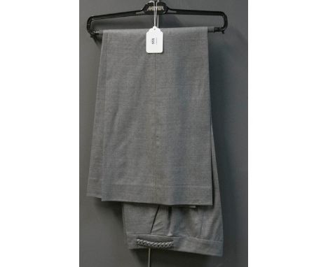 Christian Dior, a pair of lady's wide leg grey silk, wool and linen mix trousers, with side pockets and plaited detail to wai