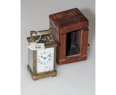 An early 20th century French brass five glass carriage clock, the eight-day gong striking movement faced by enamel Roman dial