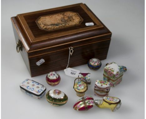 A 19th century rosewood sarcophagus form jewellery box, containing eleven Limoges and other enamel boxes of various form, inc