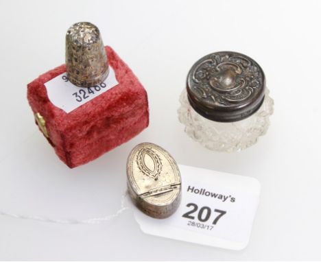 A George III snuff box, oval with prick engraved decoration, London 1795, a Victorian silver thimble in fitted case, and an E