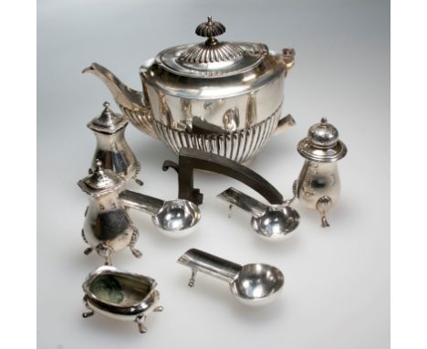 A silver teapot, oval part-fluted with ebonised finial and handle (detached), Birmingham 1916, by Alexander Clarke, together 