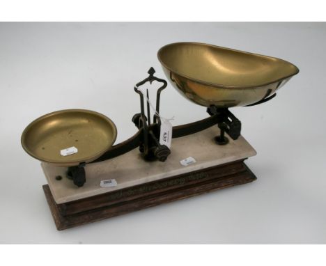 W and T Avery Ltd, a set of steel and brass pan scales, on a soapstone and wood plinth, a set of cast iron scales and various