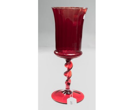 A possibly Whitefriars oversize ruby glass goblet, having inverted bell bowl, barley twist stem and conical foot, 32cm