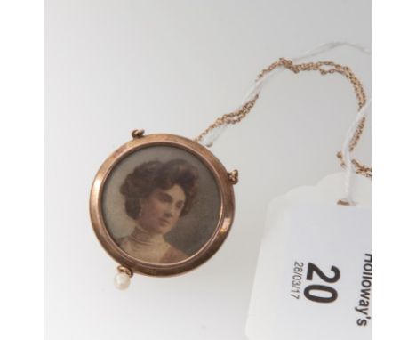A Belle Epoque gold seed pearl and guilloche enamel pendant and chain, the circular lilac enamel pendant with seed pearl to c