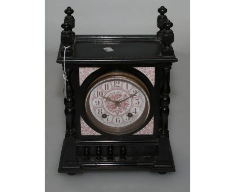 A late 19th century ebonised oak mantel clock, of aesthetic taste, the bobbin turned two pillar case enclosing an eight-day g