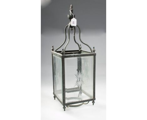 A Victorian clear glass rectangular hall lantern, with star cut detail, the copper frame with urn finials