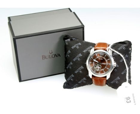 A gentleman's Bulova wristwatch, brown dial with baton numerals and outer seconds chapter ring, visible escapement aperture, 