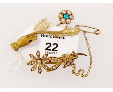 A Victorian seed pearl mounted floral spray brooch, together with a ruby, pearl and turquoise brooch in the form of a hand ho