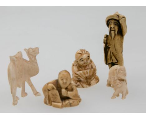 A Japanese probably Edo period carved ivory netsuke, in the forme of a Dutch merchant holding a large  palm leaf and holding 