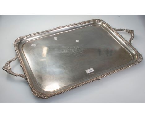 A very heavy early 20th century silver presentation tray, the rectangular form with cast border and scroll handles, bearing p