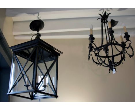 A 19th century style patinated square section hall lantern, with simple cross glazing and canopy top, together with a wrought
