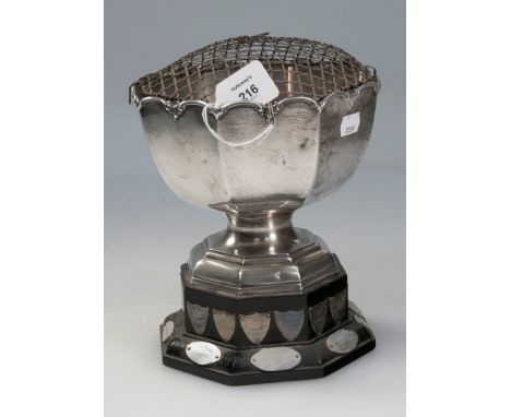 A silver rose bowl, circular scalloped form, with panelled sides, on stepped octagonal base and later plinth, commemorative e