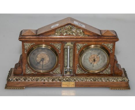 A late 19th century oak clock/barometer compendium, the architectural gilt metal mounted case with circular dials and central