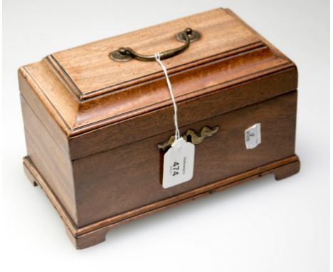 A George II/III mahogany three section tea caddy, with en tablature top, swing brass handle and 'bat wing' escutcheon, raised