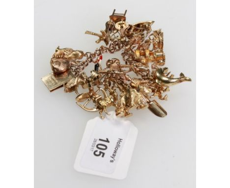 A charm bracelet, the double link chain bracelet suspending multiple charms, including an enamel soldier, a church, an articu