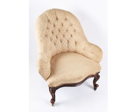 A 19th Century carved walnut and rosewood framed nursing chair with patterned button backed upholstery, height 89cm.