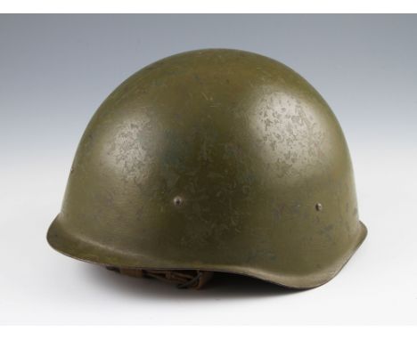 A Cold war Russian green helmet with liner, dated to interior 1948.