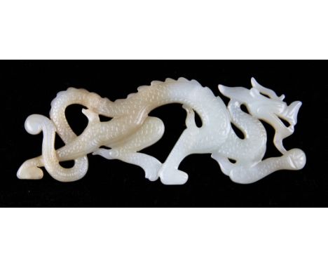 A Chinese white jade pendant in the form of a running dragon with carved detailing to both sides, length 13cm, c.18th - 19th 