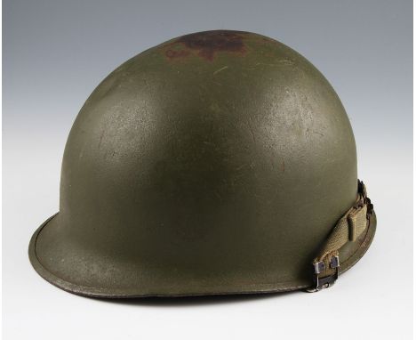 A US M1 pattern helmet with medium green finish with liner.