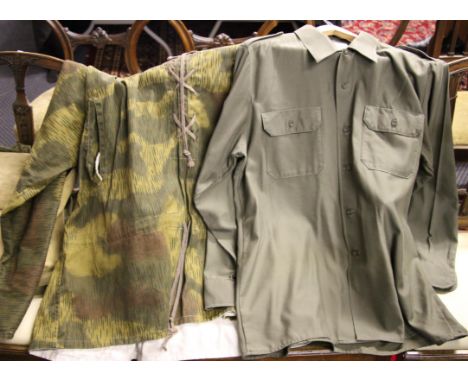 A lot to include; German back pack, small light coloured kit bag, green US army shirt plus camo design smock.