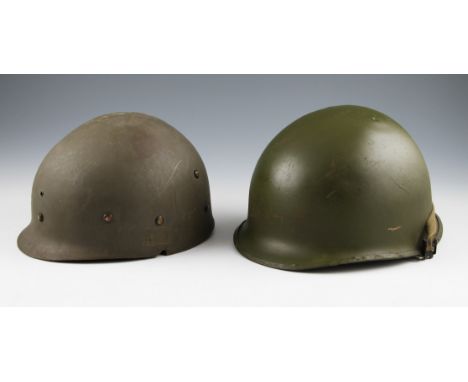 A US M1 pattern helmet with green finish with liner, large weld repair to one side.