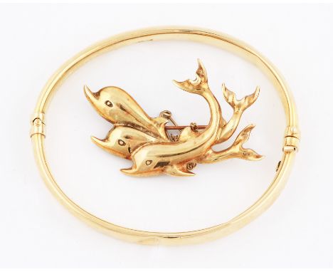 A dolphin brooch, complete with safety chain, stamped 585, weight approx. 9.5g, together with a hinged bangle, stamped 375, w