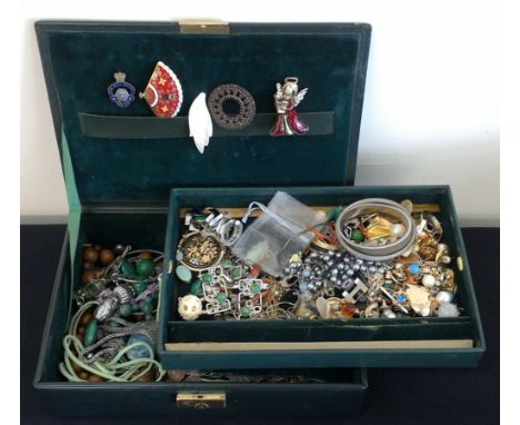 A quantity of various costume jewellery to include yellow metal chains, brooches, earrings, pendants, simulated pearls, stick