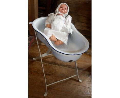 Vintage 1930's Schildkrot celluloid baby doll in a doll's enamel bath on stand