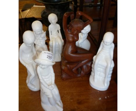 Six Spode Pauline Shore white glazed figures and a carved hardwood figure of a naked lady doing her hair