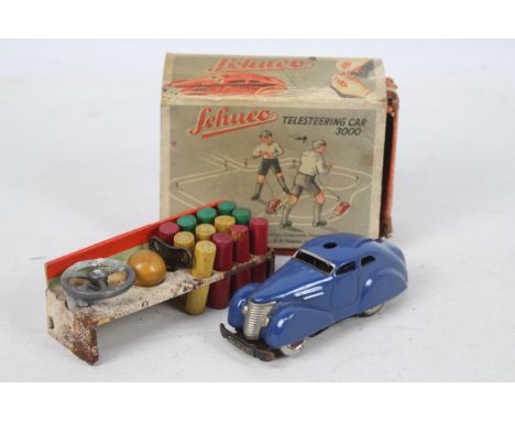 Schuco - A boxed Schuco 3000 Telesteering car. The car has little wear but has some corrosion on the wheels and steering whee