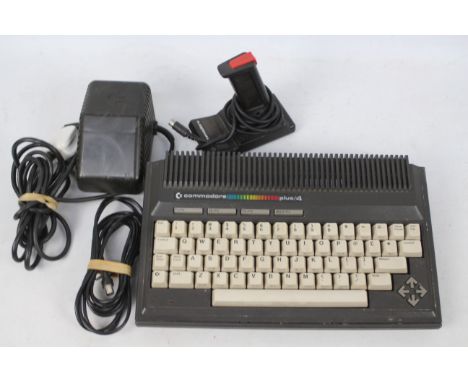 Commodore - A vintage Commodore plus/4 console with power lead and a controller. # 264 Series. It appears Physically in Good 