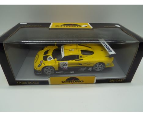 Chrono - a 1:18 scale model diecast racing car, Lotus Elise GT1 Franck Muller 1997 yellow # H1070, appears mint in window box