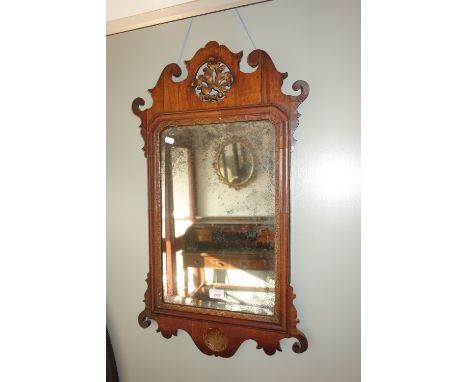 A GEORGE II CHINOISERIE MIRROR in the manor of Chippendale with original glass, 75 cm high