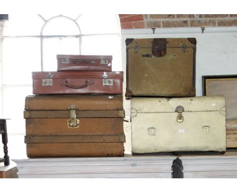 A COLLECTION OF VINTAGE TIN TRUNKS and leather cases