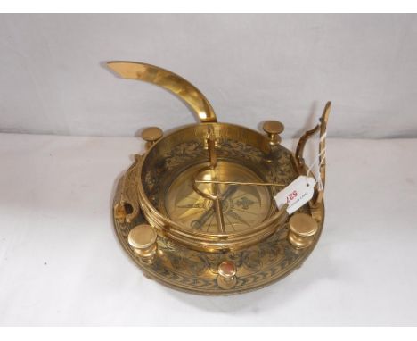 A NINE INCH BRASS COMPASS with sundial, circa 1962